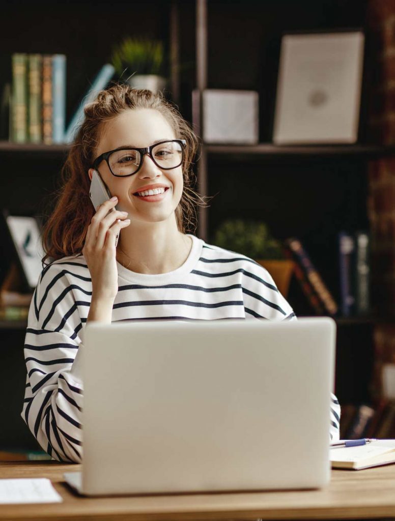 Image of girl working from remote workstation at home.